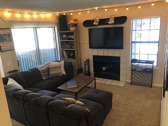 Open living room with wood burning fireplace