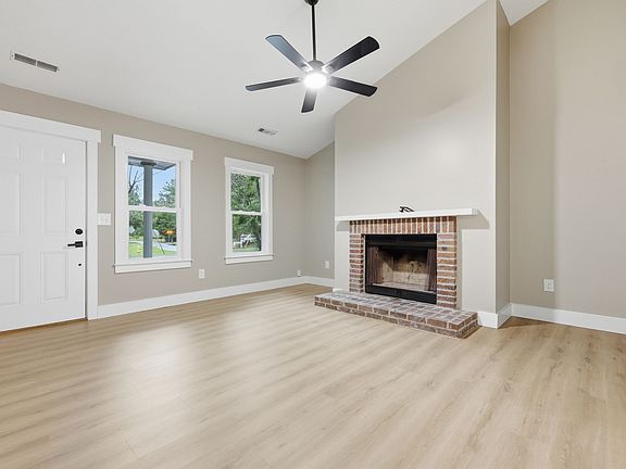 Cozy living room with high ceilings and fireplace