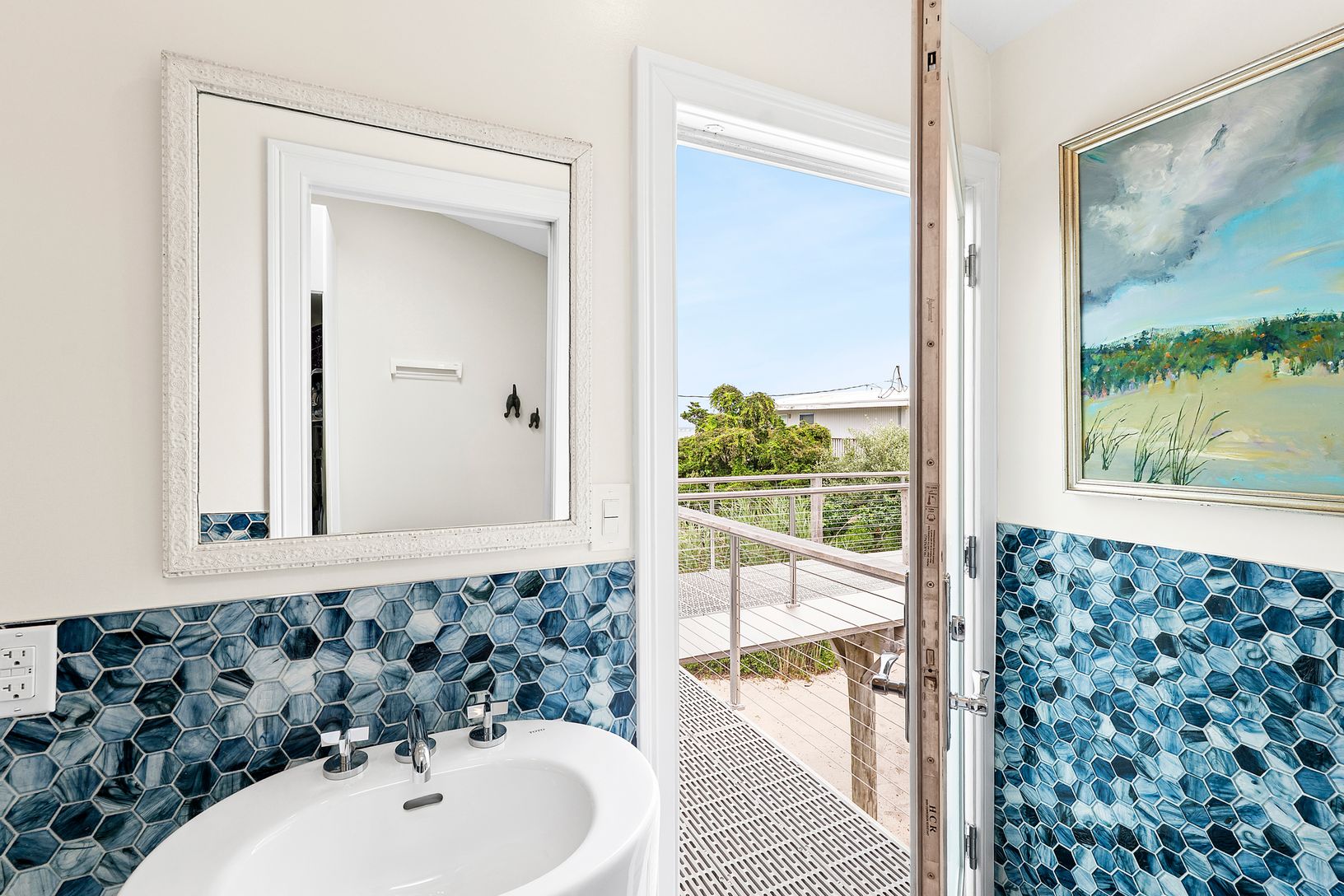 Half bathroom that also opens to outdoor deck.