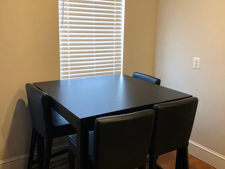 Open floor plan- furnished dining area with table and chairs