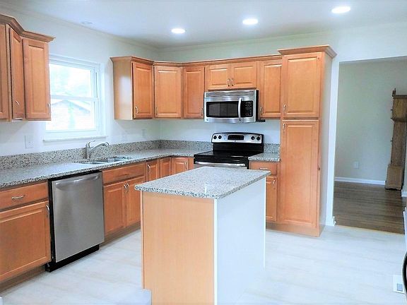 Large Kitchen with a lot of cabinets for storage! New flooring, granite counter tops and dishwasher!