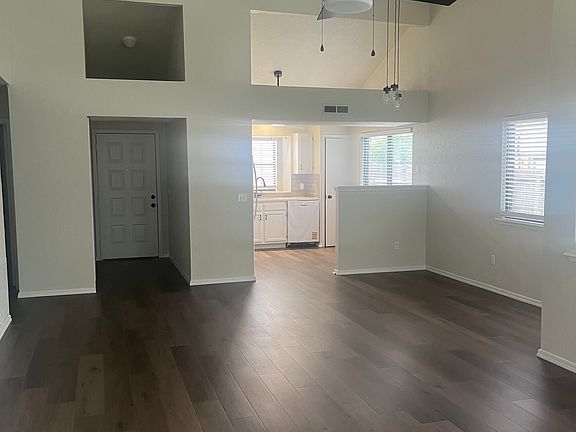 living room looking back to front door and kitchen