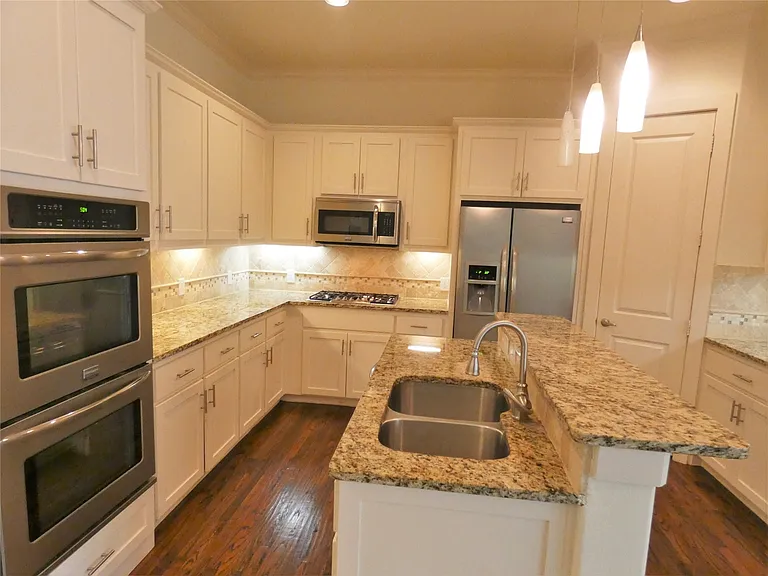 Kitchen with granite counters and stainless appliances!