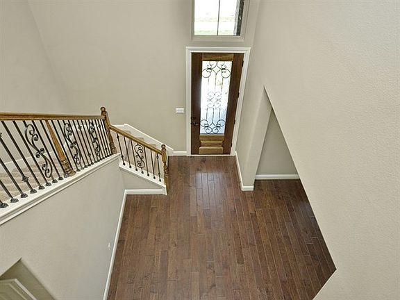 Two-Story Foyer & Rich Hardwood Floors