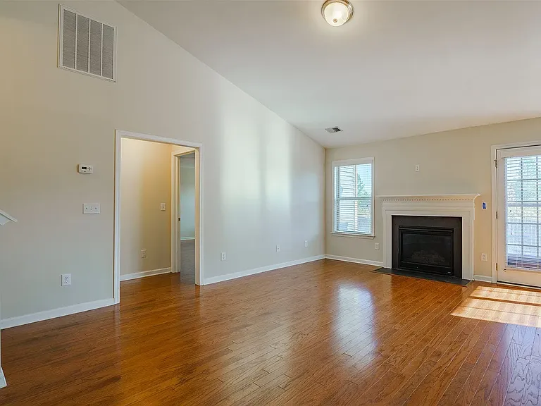 Large opening/hallway to primary suite downstairs with enough turning radius for a large wheelchair.