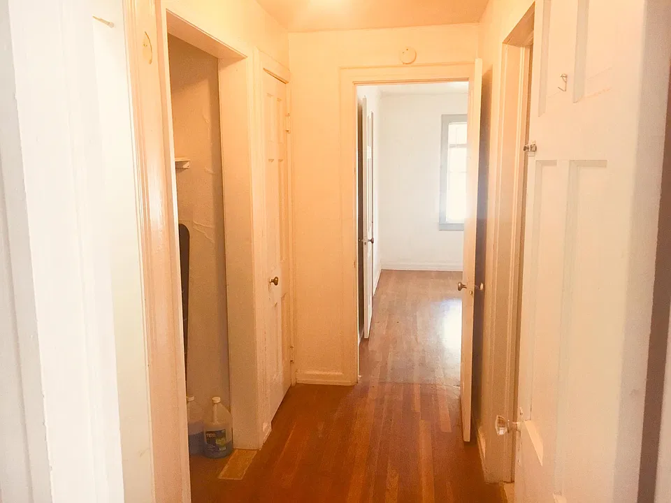 Hallway, laundry room is on the right in large closet
