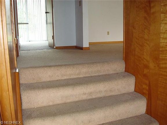Stairway to the hallway. Go right into the living room.  Go stra