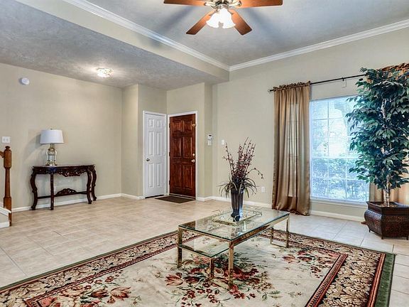 Light and bring, this formal living room features high ceilings and tile flooring what a show stopper.