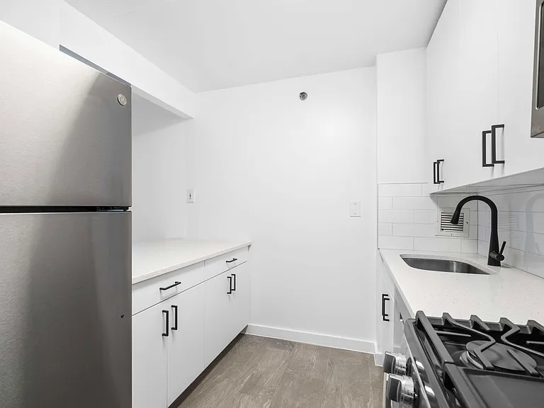 Sleek stainless steel appliances and modern cabinetry