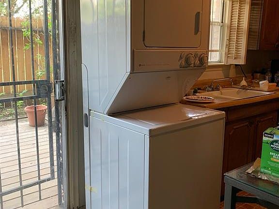 Stacking washer and dryer to be sold with condo.