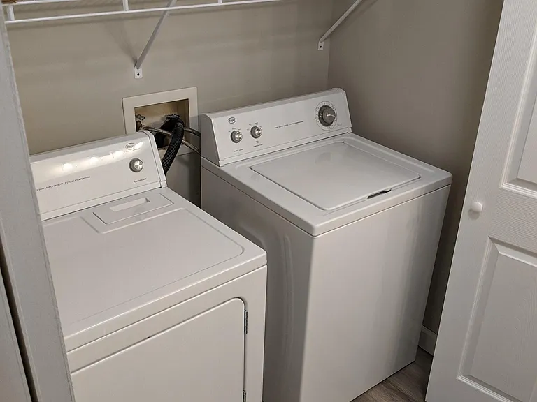 Full sized washer and dryer closet in master bathroom