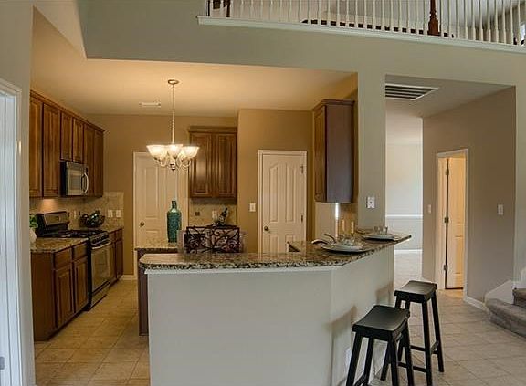 The kitchen is an airy open-plan space designed to entertain guests