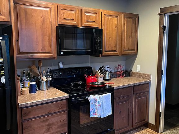 Kitchen with partial view of island.