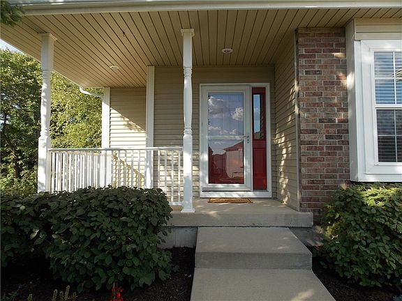 Spacious front porch overlooks beautiful, mature landscaping!