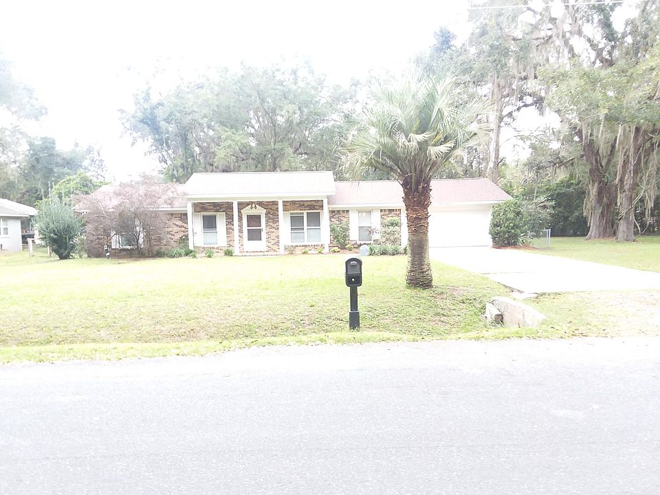 Front of the house, note 2 car garage and the large yard