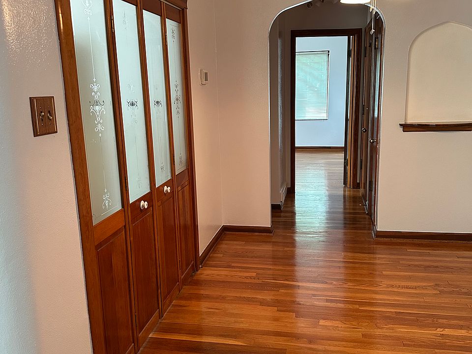 Dining room with wooden doors closing off the kitchen