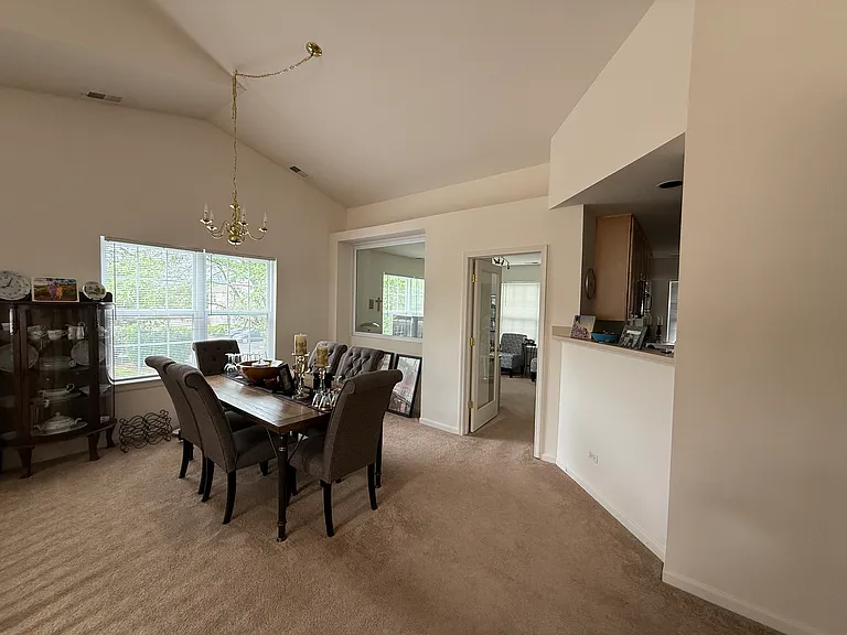 Elegant open-concept dining space perfectly situated for seamless entertaining, flowing effortlessly between the kitchen and main living areas.