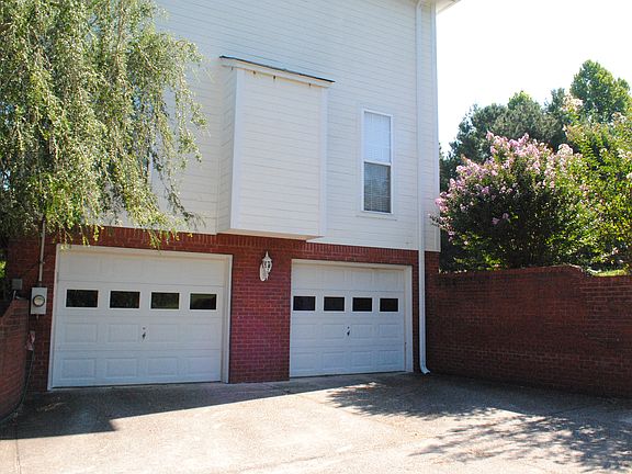 Side with 2-car garage