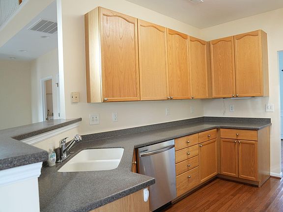 Ample storage space, solid surface countertops, new dishwasher