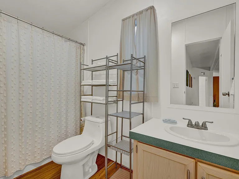 main bathroom with brand-new toliet and tub/shower combo