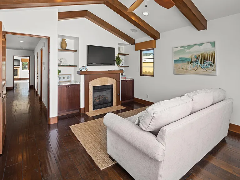 Upstairs TV room with couch sofa bed and balcony, fireplace, TV