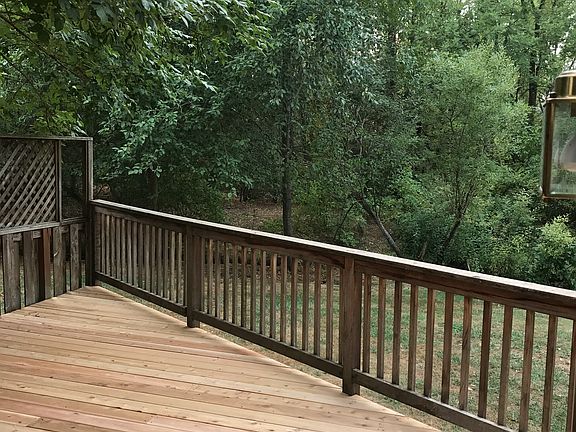 view from deck to wooded area