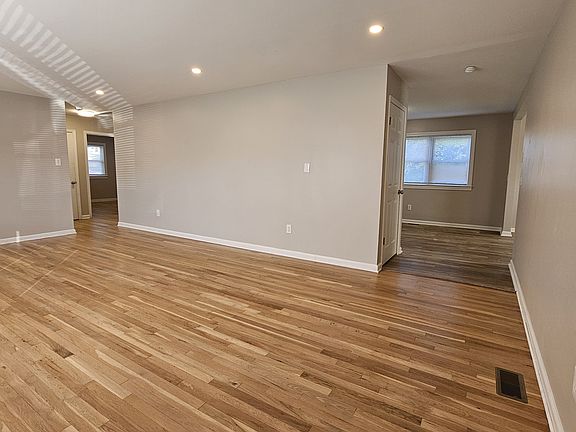 Living Room with Hardwood Floors and Recessed Lights