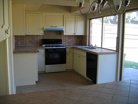 View of the kitchen and back door from the living room