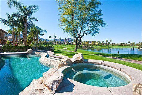 This triple fairway, mountain, lake and pool view can be seen from the great room, nook area,kitchen