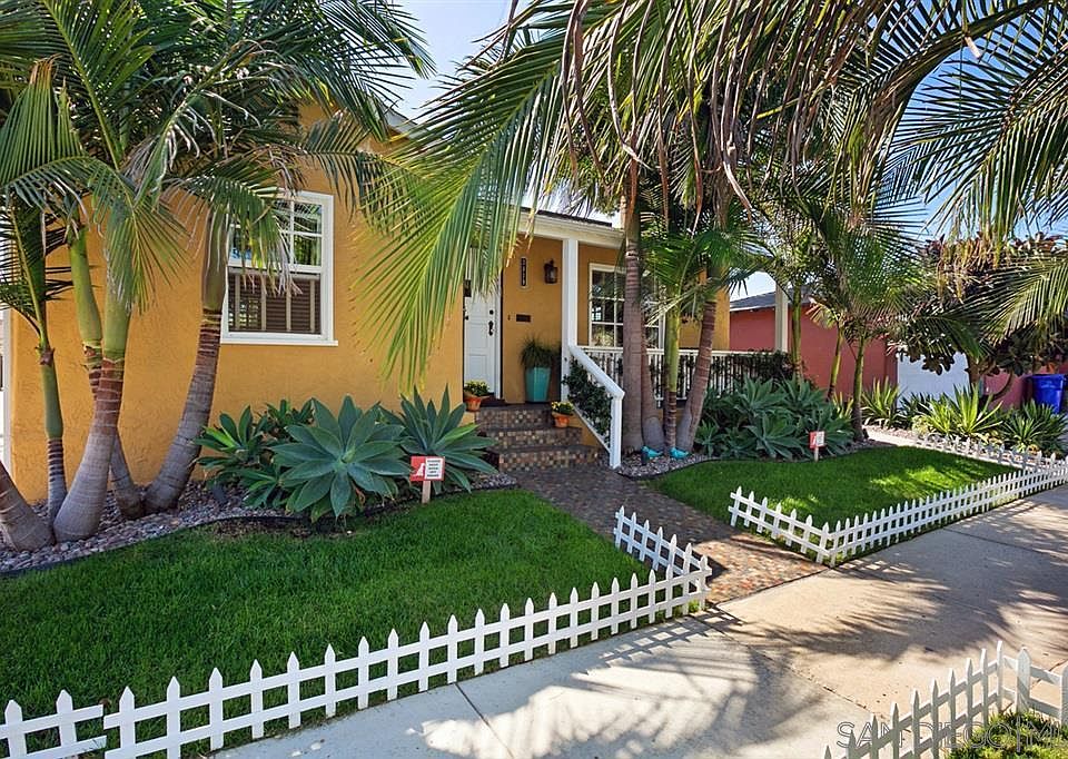 This image shows Part of the property that is visible from the Street Side. Entrance to the Apartment is located on the left side of the Picket Fence