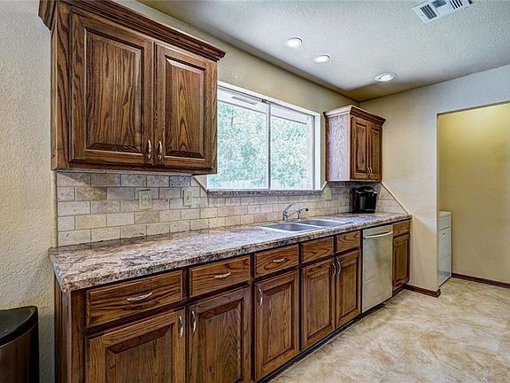Kitchen with Custom Solid Oak Cabinetry, new Counter Tops, and new Ceramic Flooring
