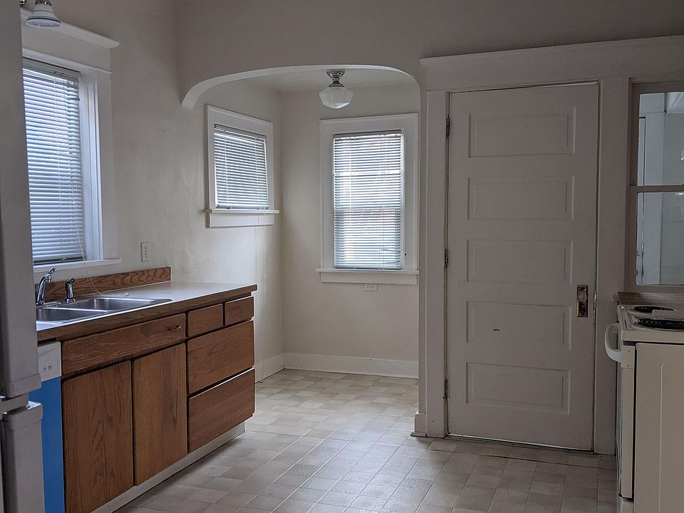 Kitchen facing back door and breakfast nook