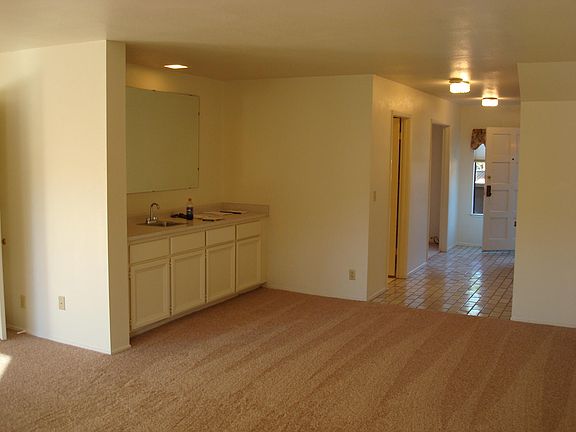 wet bar in living room and front entry hall