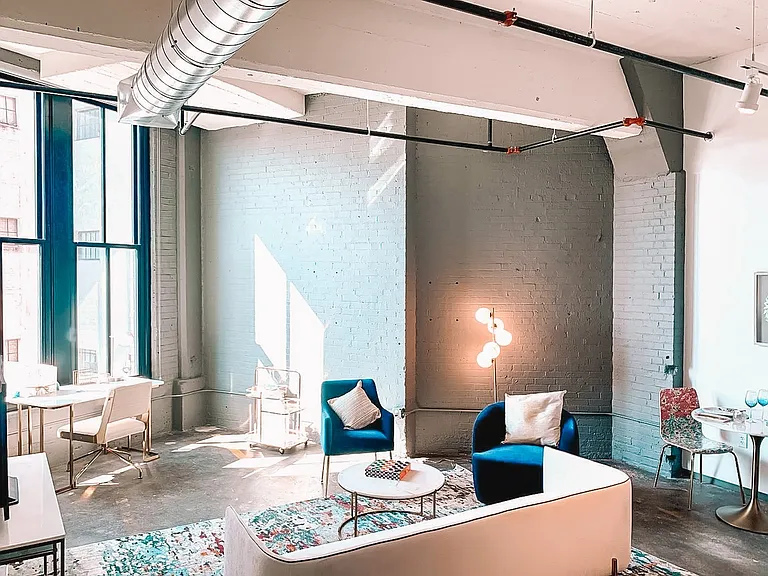 Exposed Concrete + Brick Accents