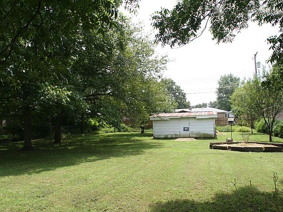 Large Fenced Yard with Storage Shed