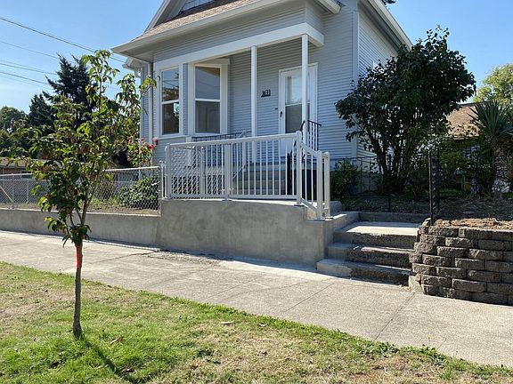 front of the house with Stainless steel railings and fencing all around.