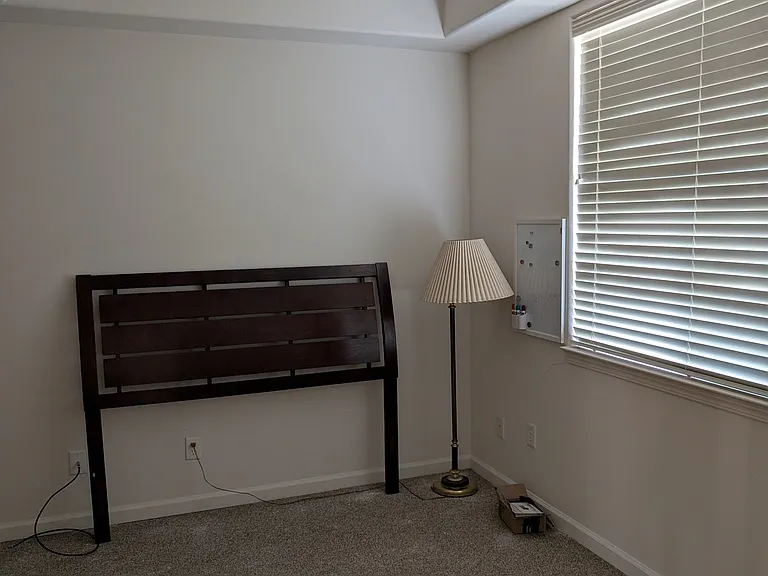2nd downstairs bedroom with windows to the front. Tile floors now.
