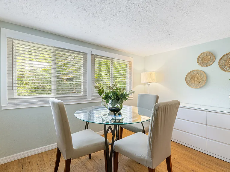 Bright open dining area with abundant natural light from multiple windows.