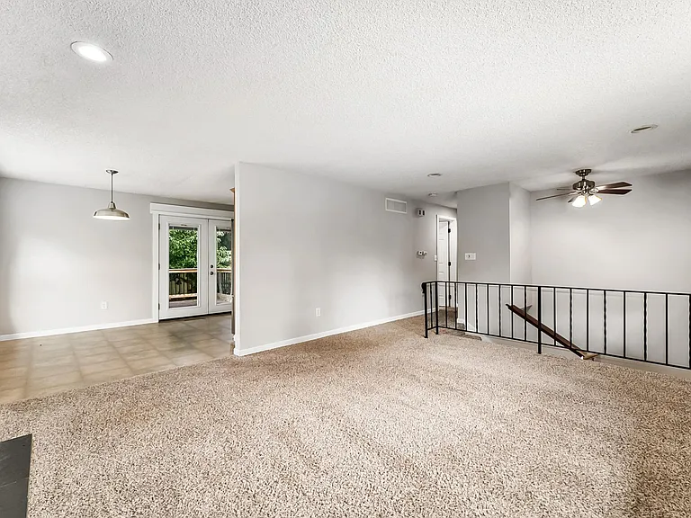 Living Room on upper level. Carpet has been replaced with new LVP Flooring.