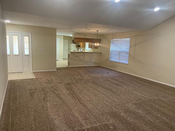 living and dining area, view of front door