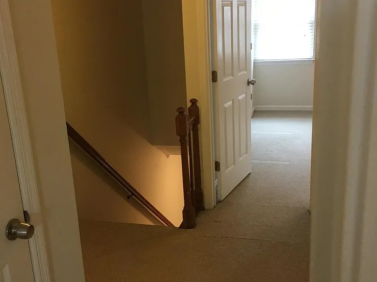 top floor landing. Extra storage closet and a laundry room in this area. Plus attic storage above