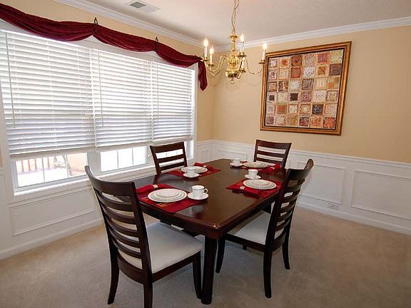 Frml dining room flows into family room through archway!