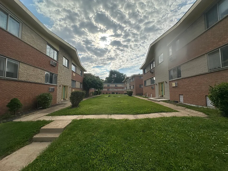 Common area with front door access into common stairwell. 4 apartments per building