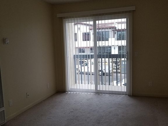 Living Room overlooking ocean view as you step onto balcony.