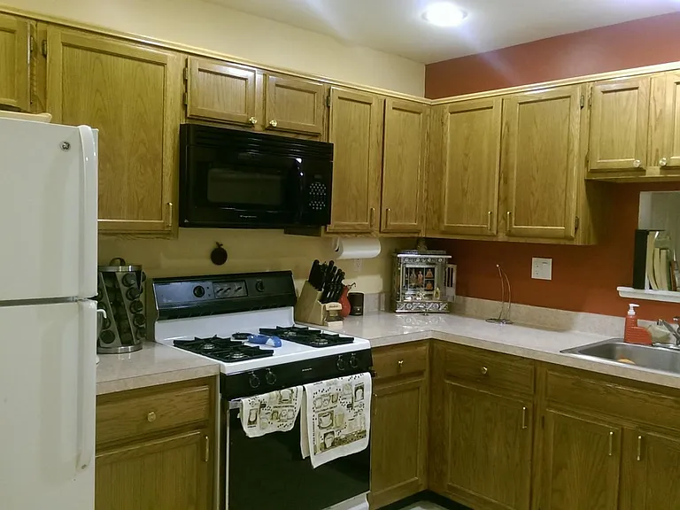Large kitchen with ample storage and full appliances.