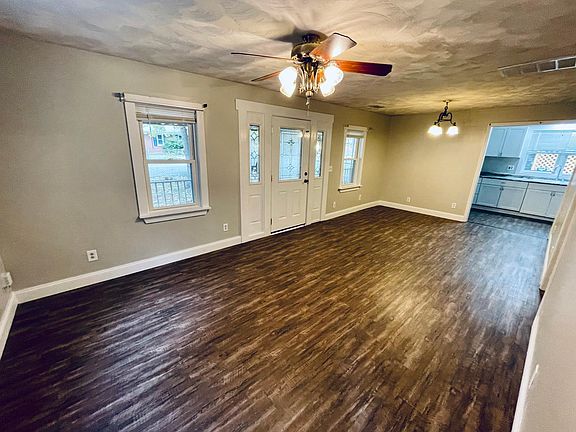 Spacious living and dining room area opens up to kitchen