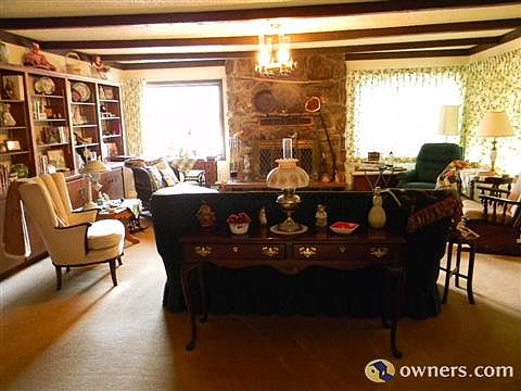 Inviting living room with built-ins and fire place