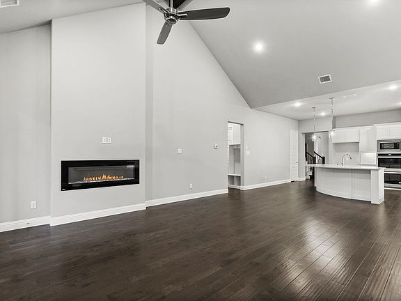Living room in the Waldorf II home plan by Trophy Signature Homes - REPRESENTATIVE PHOTO