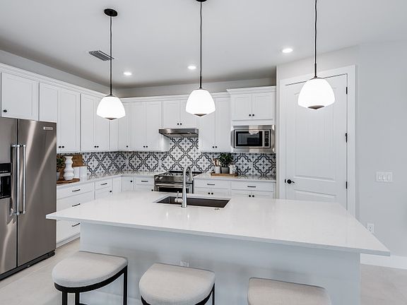 Kitchen with center island and stainless steel appliances