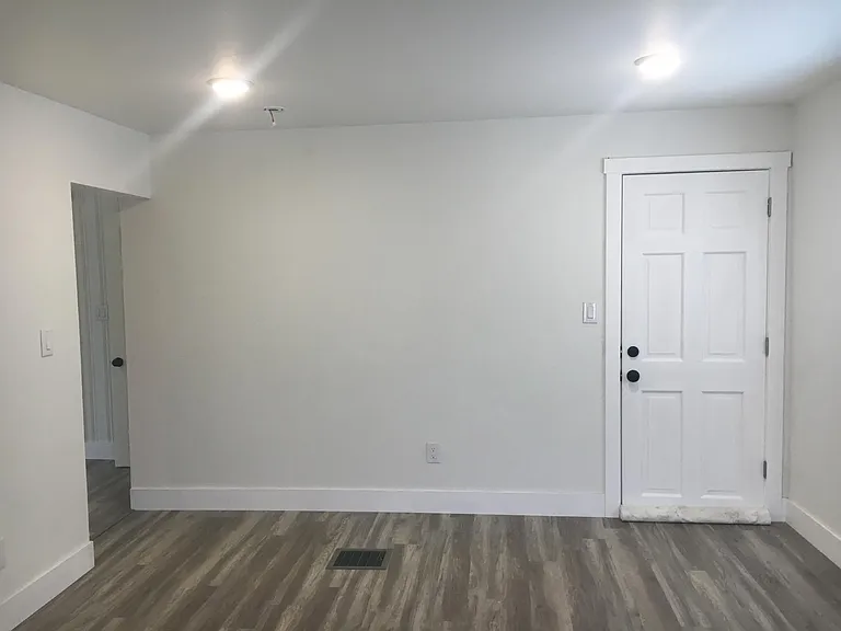 Living room, passageway on left of photo leads to common room.